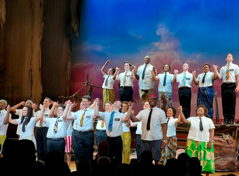 Tony Moreno and the cast of The Book of Mormon on Broadway taking their bows
